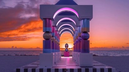 Surreal architectural portal by Pilar Zeta at sunrise, blending neon light and geometric design.