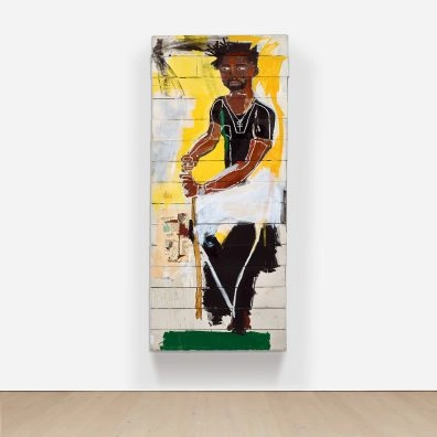 Basquiat's “To Repel Ghosts” painting featuring a black figure on yellow and white background at Moco Museum Barcelona