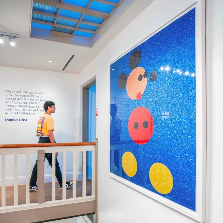 Large Takashi Murakami artwork featuring Mickey Mouse at Moco Museum Amsterdam.