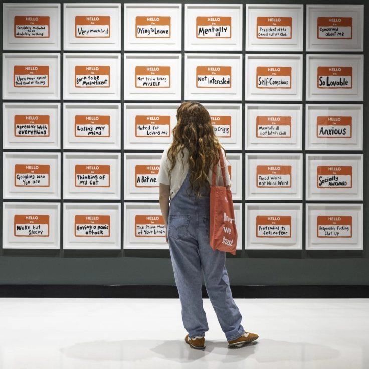 Visitor viewing Robbie Williams artwork at Moco Museum Barcelona.