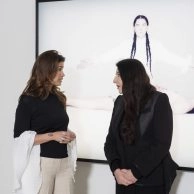 Kim Logchies and Marina Abramovic standing in front of artwork at Moco Museum