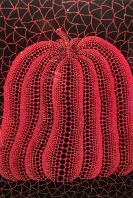 Yayoi Kusama red pumpkin sculpture with black net pattern