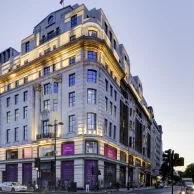 Street view of Moco Museum London on prominent corner in Mayfair.